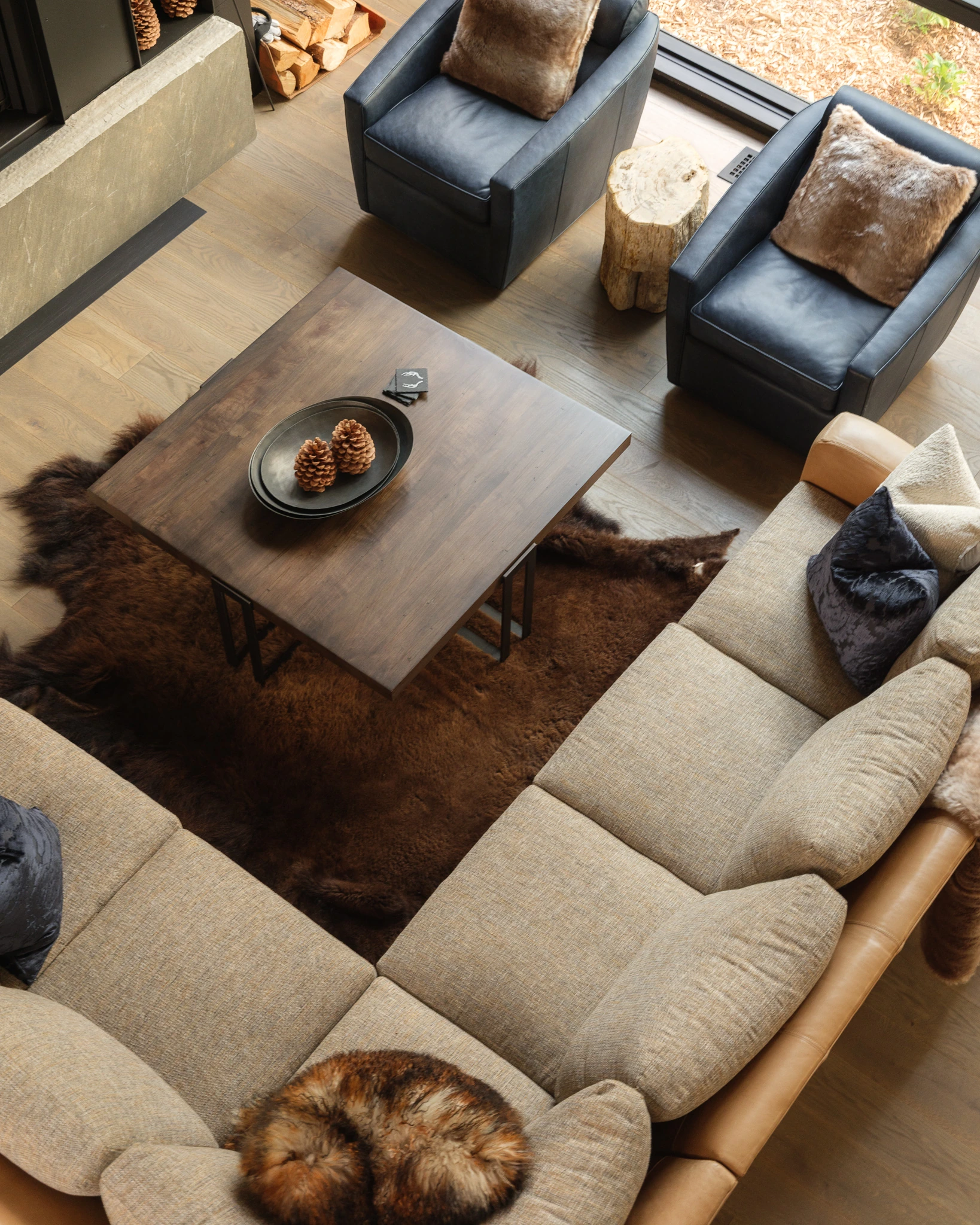 Overhead view of the great room sectional and leather chairs — architectural photography Big Sky Montana, Speedwell Cabin